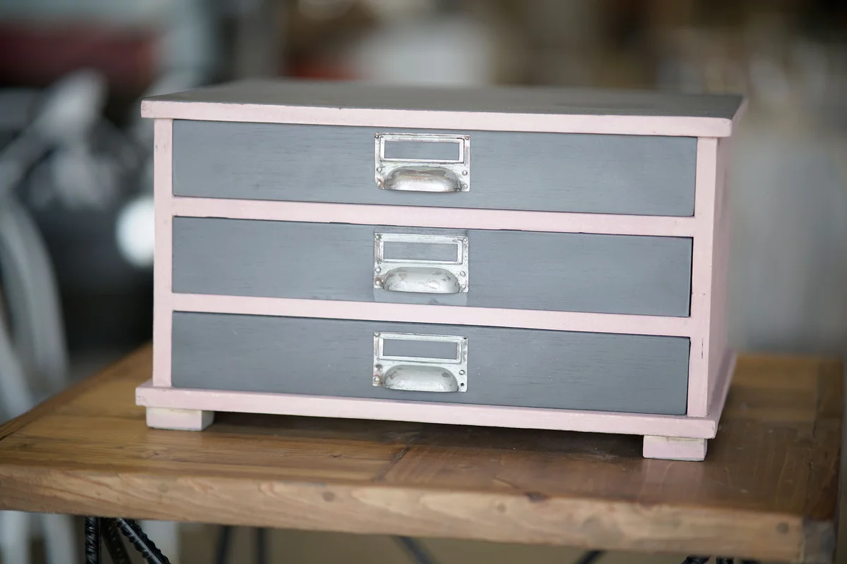 Small three-drawer chest in pale pink chalk finish with grey drawer fronts